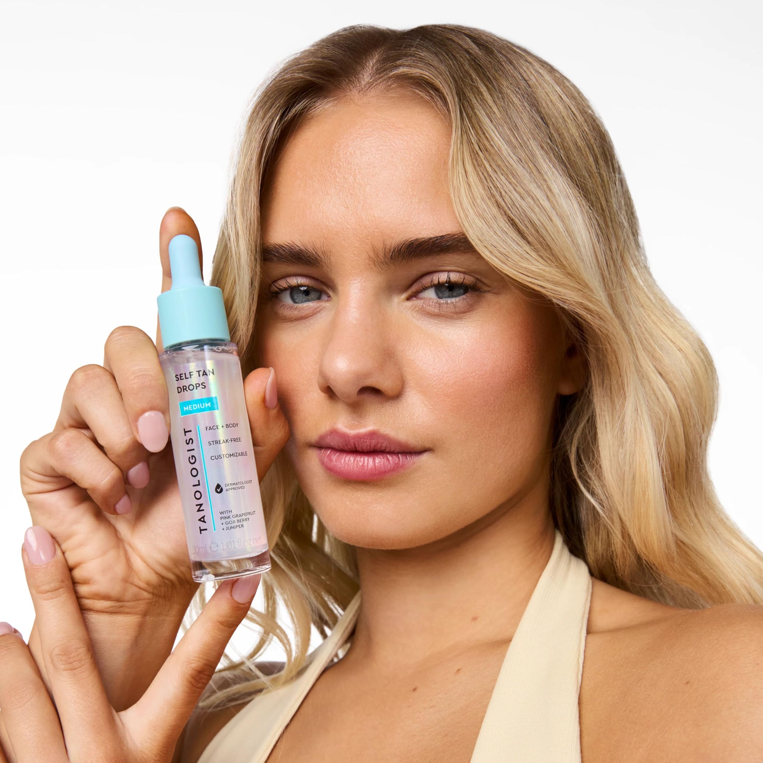 Tanologist drops on bathroom vanity staged to show everyday skincare routine compatibility