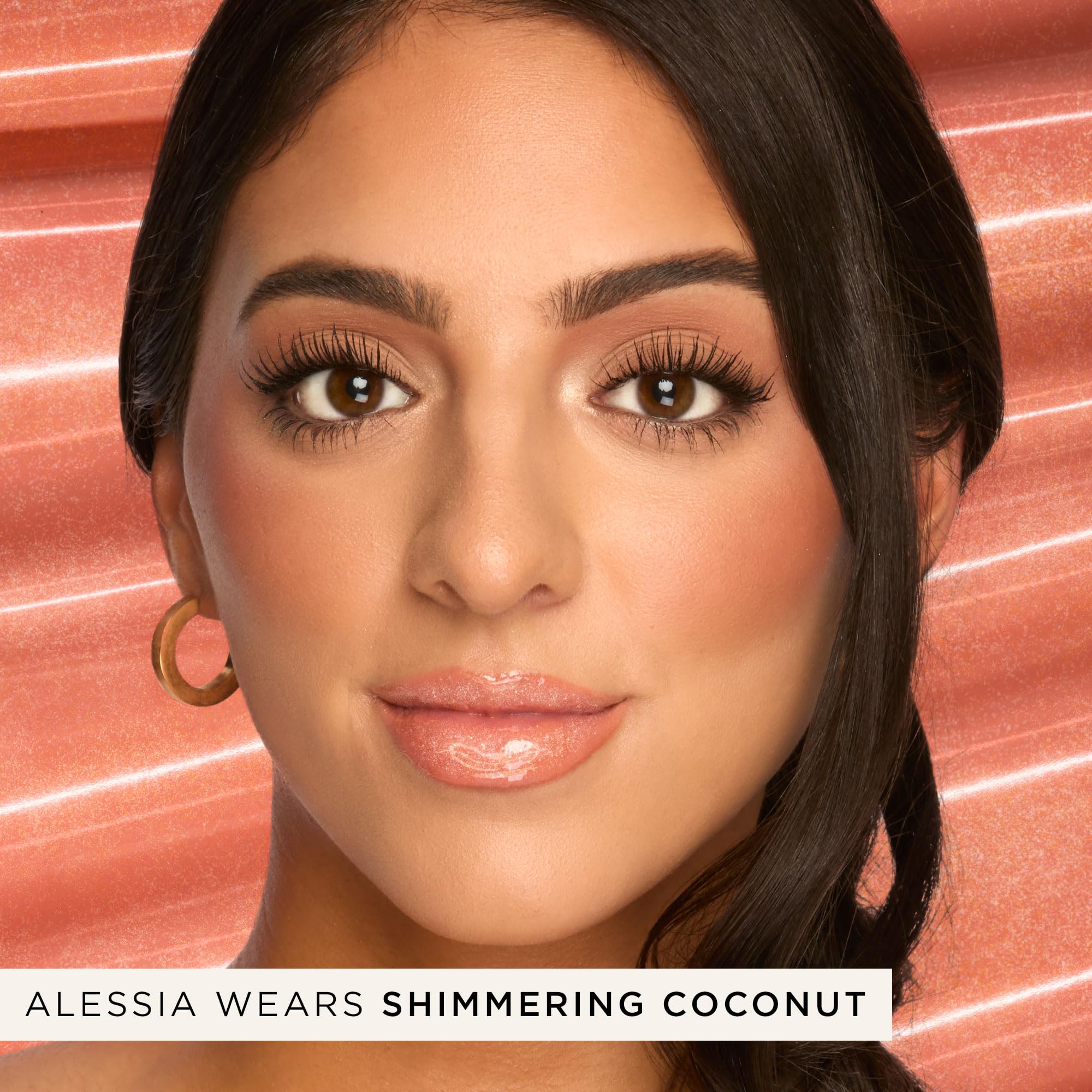tarte texture swipe on arm showing glossy finish and sheer shimmering coconut tint