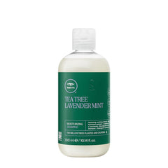 Tea Tree leave-in spray in hand demonstrating lightweight conditioning and shine