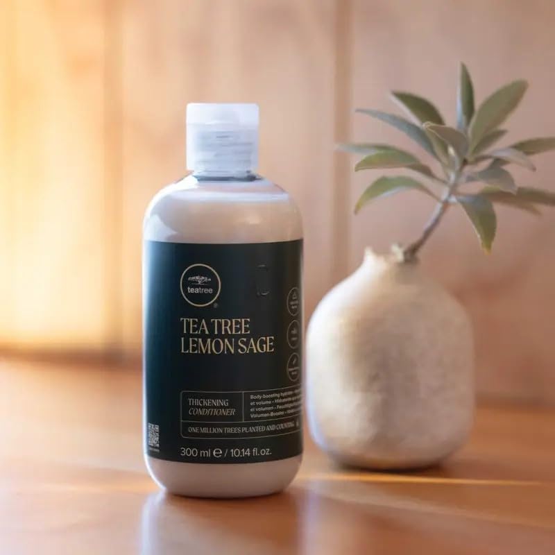 Tea Tree conditioner being applied to wet hair for detangling benefit