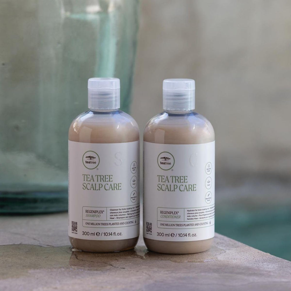 Tea Tree shampoo on a bathroom shelf, evokes everyday styling routine