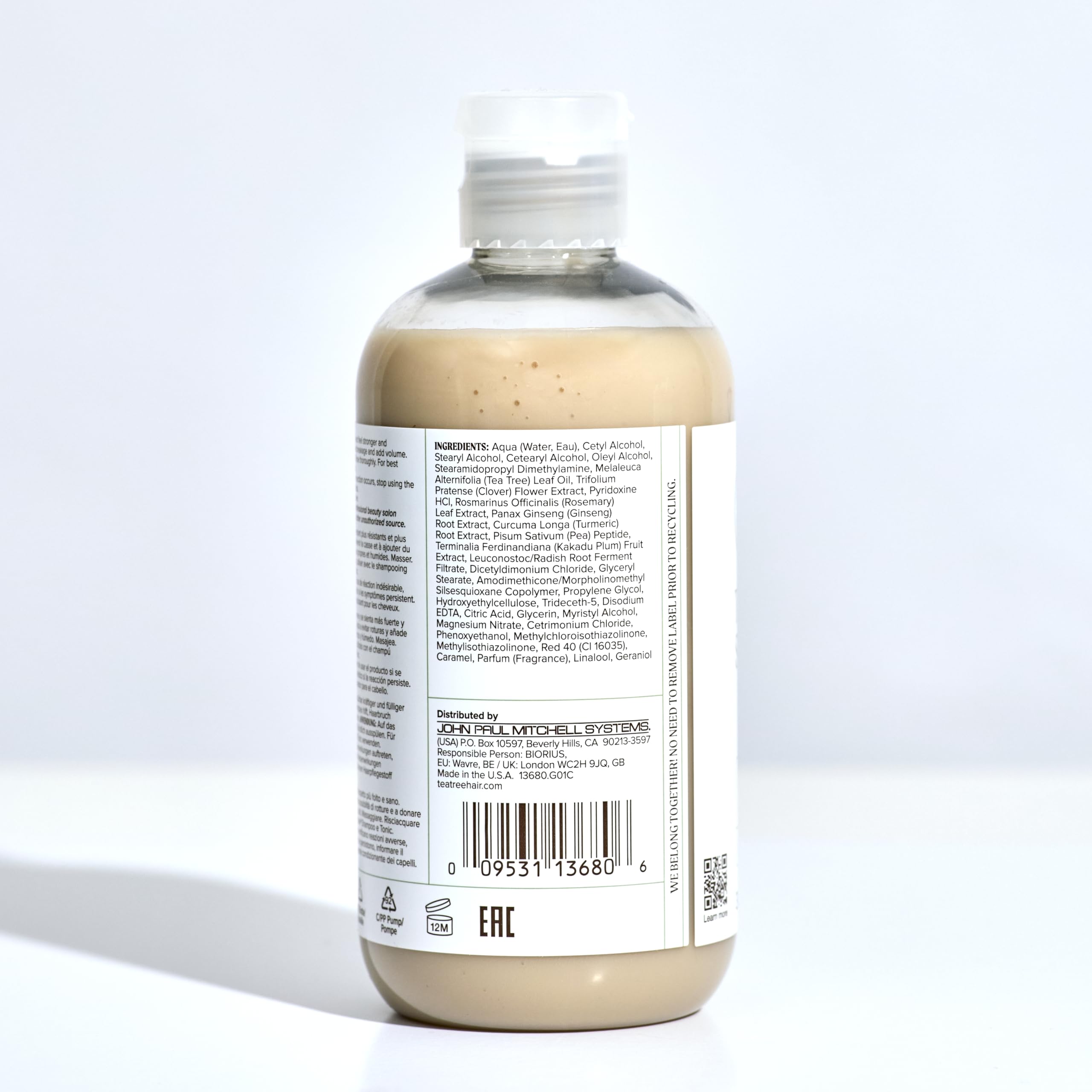 Tea Tree bottle on bathroom shelf in routine setting for salon-quality benefit