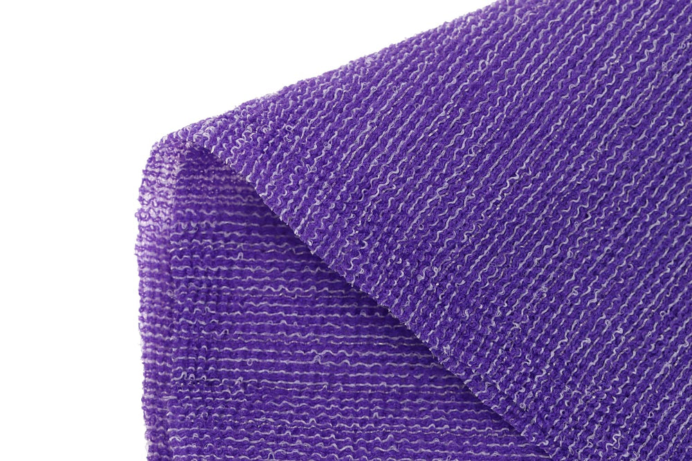 Terra Distribution towel next to hand showing scale and length