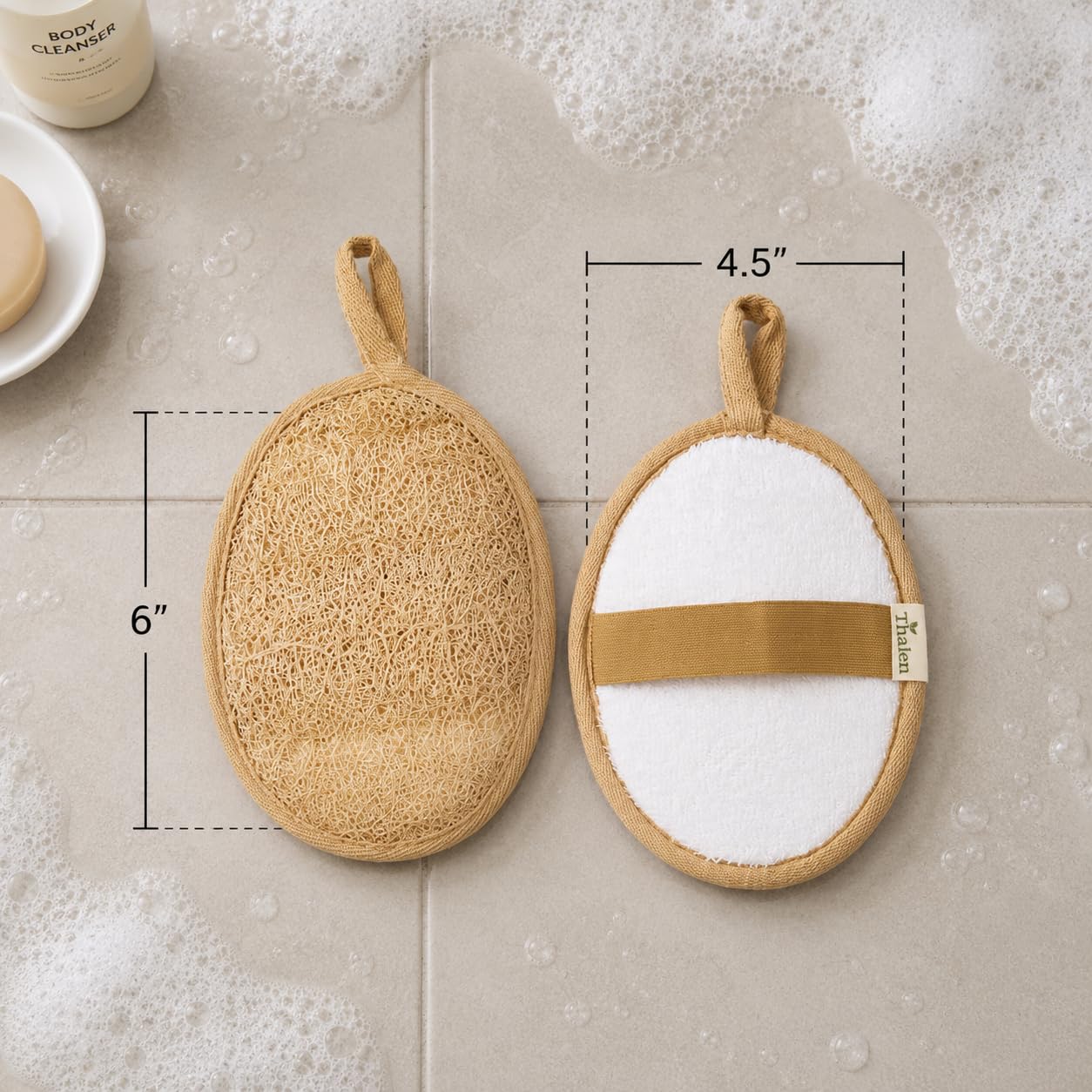 Thalen loofah next to hand for scale showing compact travel-friendly benefit