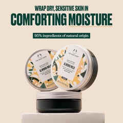 The Body Shop almond milk open jar texture close-up showing creamy, spreadable finish