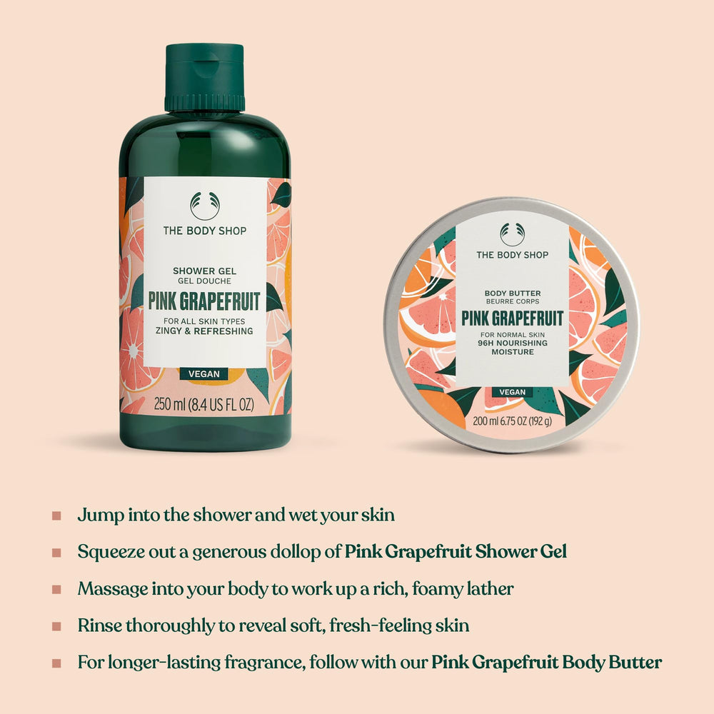 The Body Shop pink grapefruit size scale beside toiletries for travel-friendly convenience