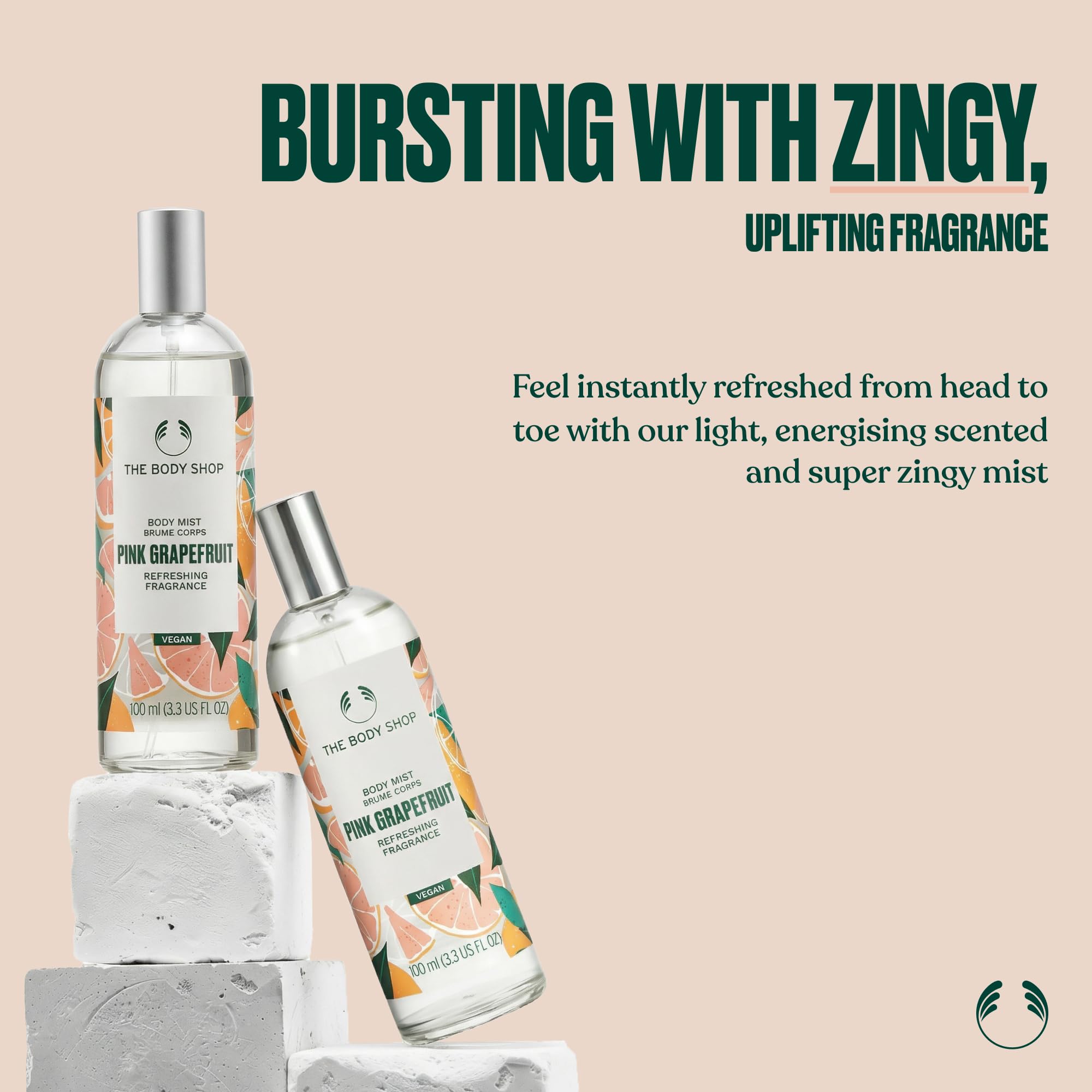 The Body Shop mist spraying pink grapefruit scent for instant refreshing benefit