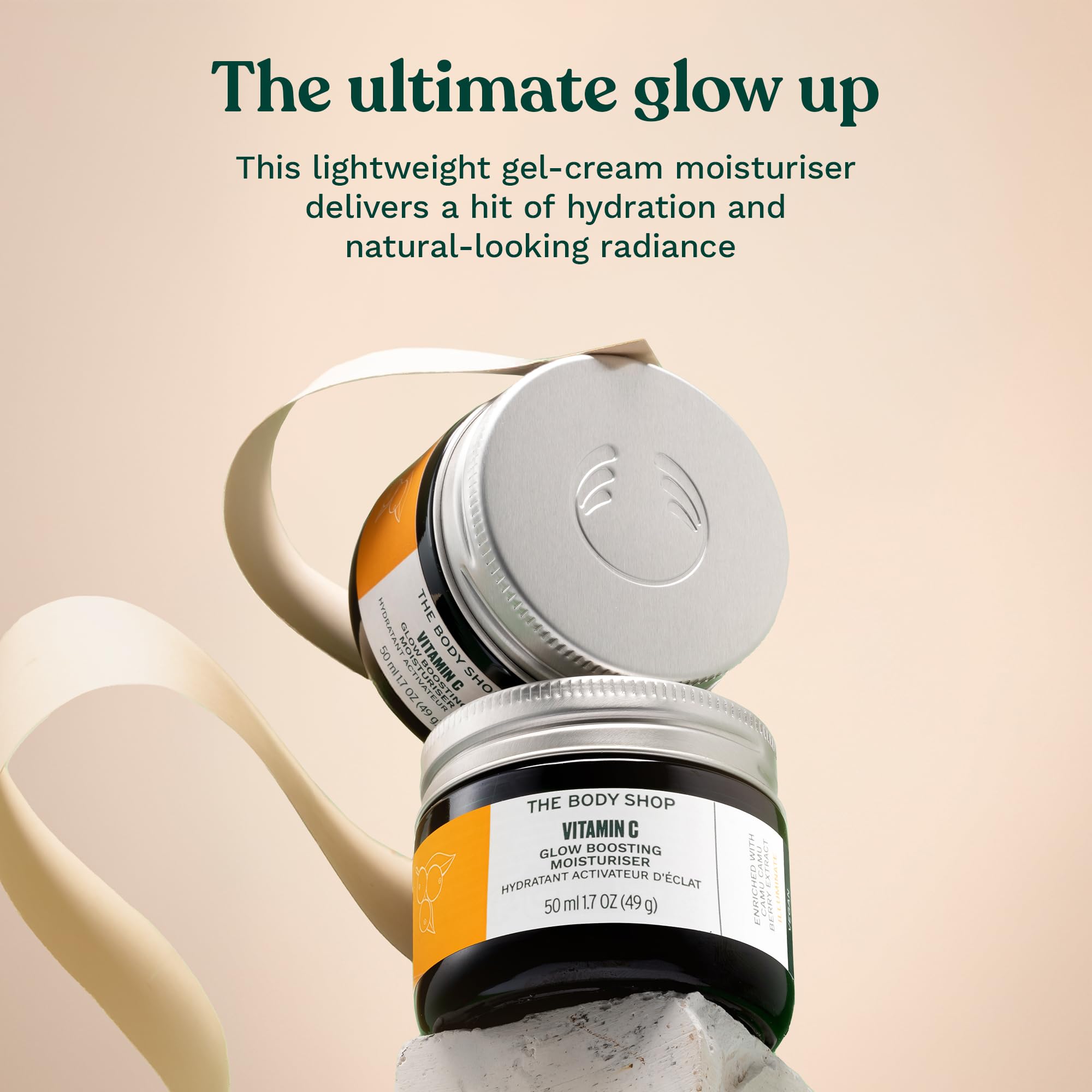 The Body Shop open jar top view showing creamy gel and easy absorption