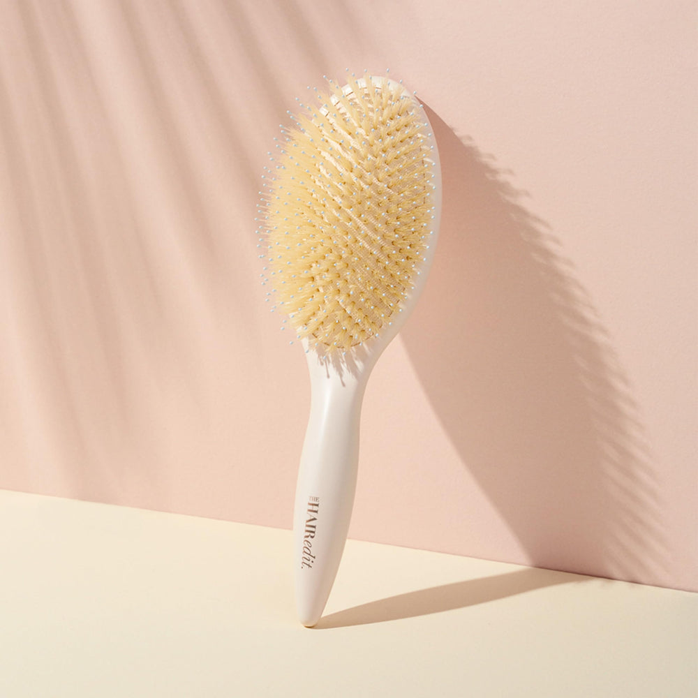 The Hair Edit bristles smoothing strands to redistribute natural oils