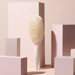 The Hair Edit cushion base side profile showing flexible bristles for comfort