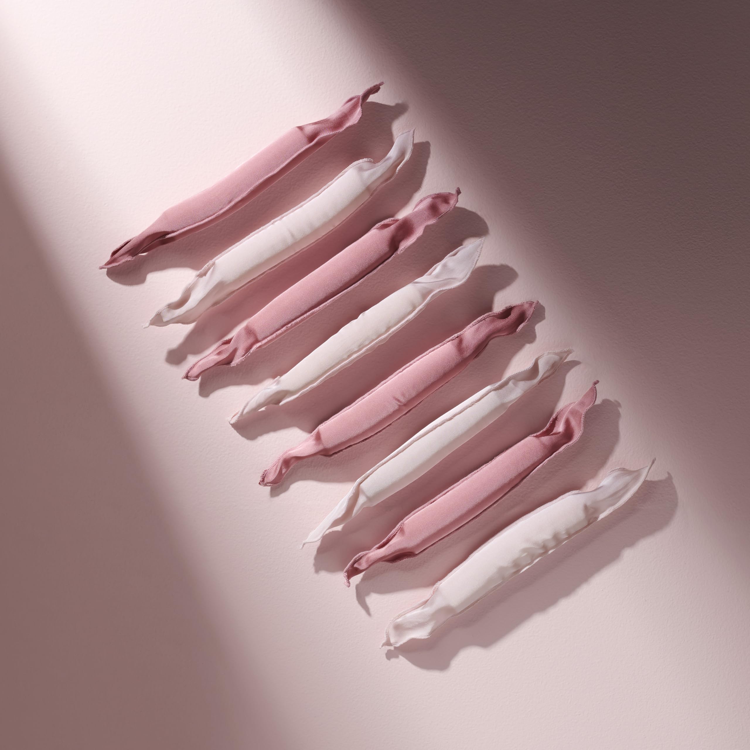 The Hair Edit roller held in hand showing scale, lightweight and travel-ready