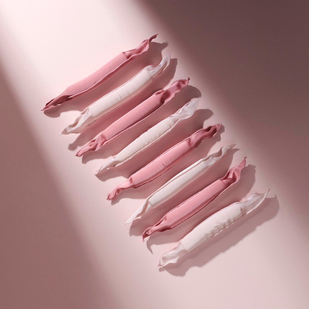 The Hair Edit roller held in hand showing scale, lightweight and travel-ready