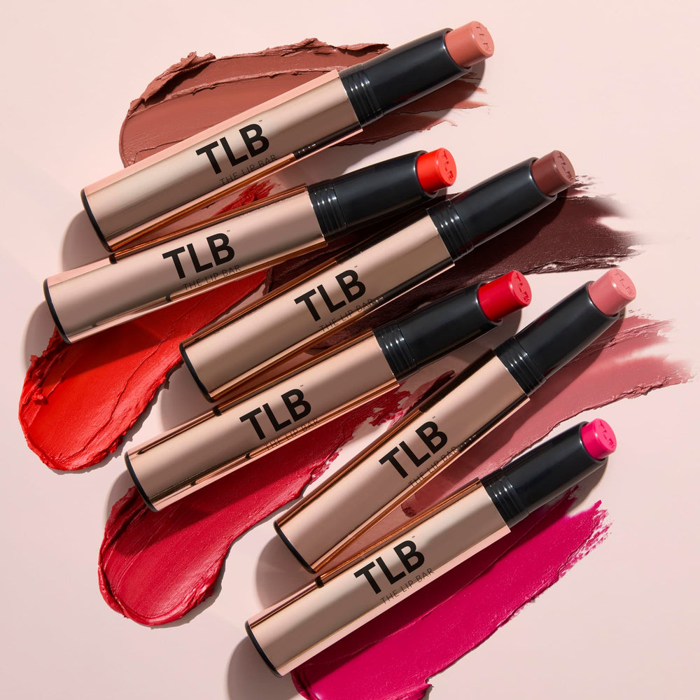 The Lip Bar in hand scale showing compact size and travel-friendly benefit