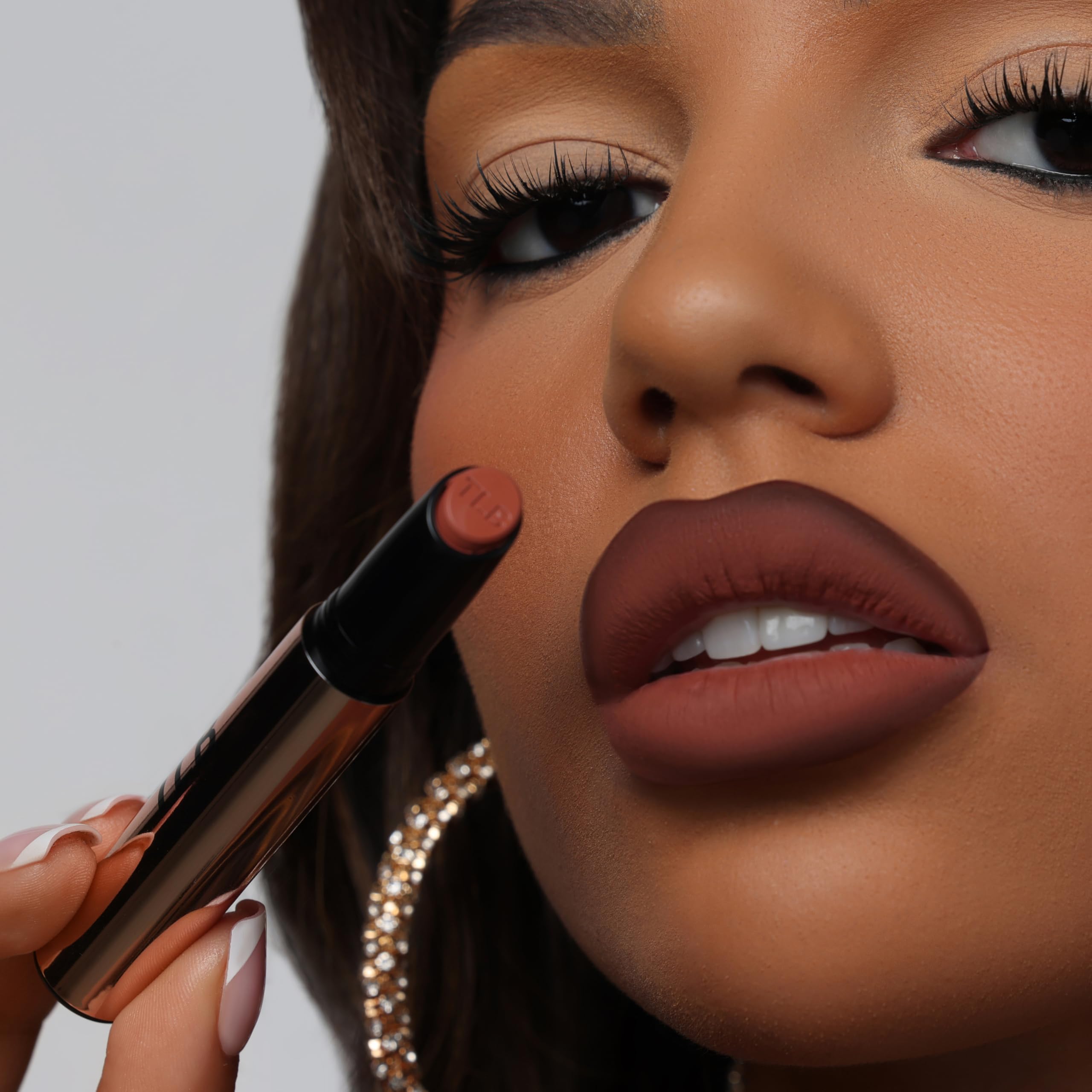The Lip Bar lipstick texture close-up showing smooth matte finish and comfortable wear