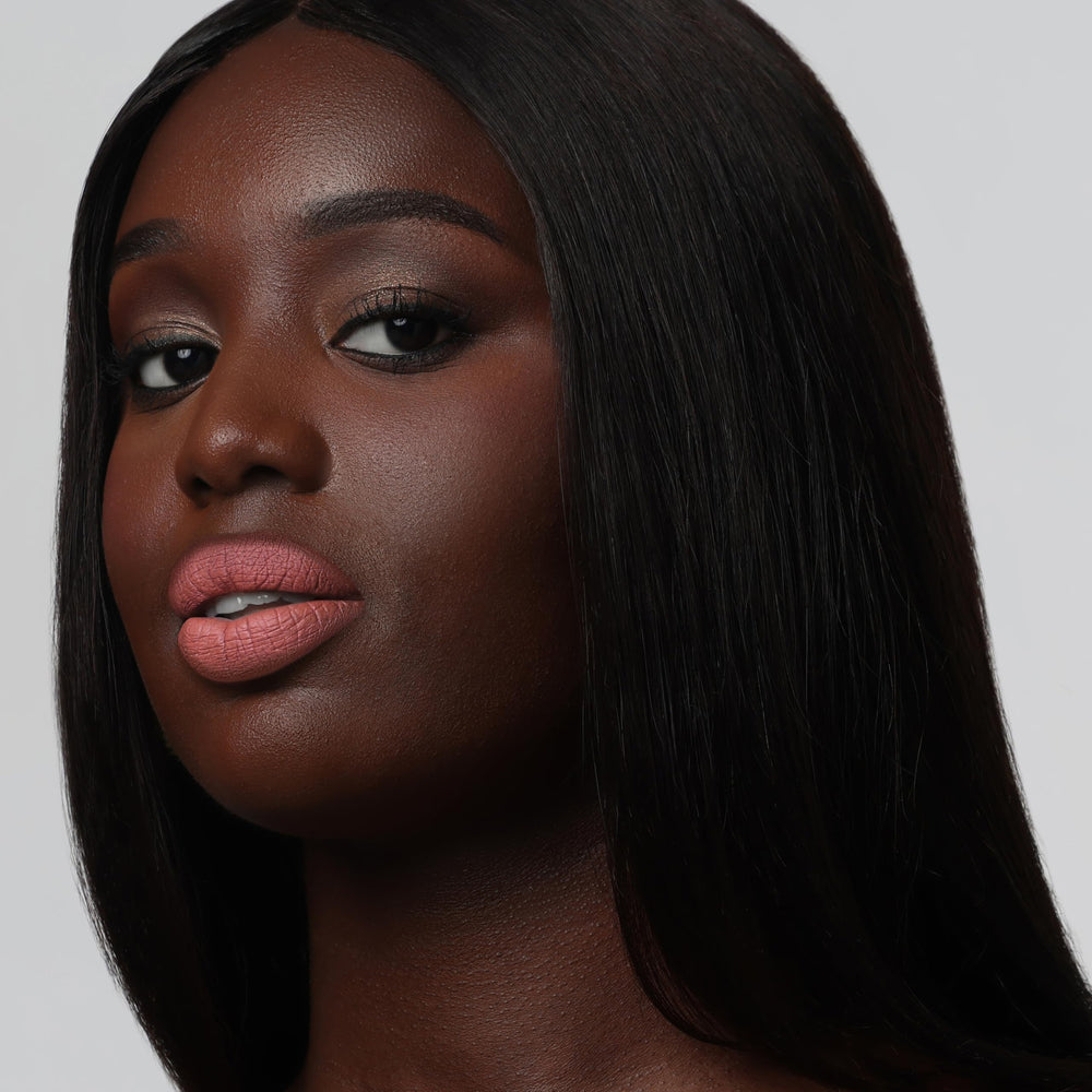 The Lip Bar texture swatch close-up showing smooth matte pigment benefit