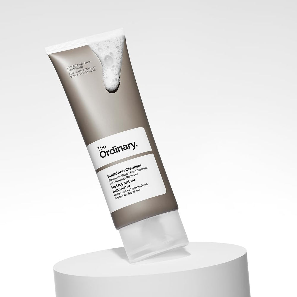 The Ordinary beside a credit card for scale, showing the 8.1 fl oz size