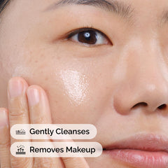 The Ordinary close-up of balm texture on fingertip, showing silky moisturizing feel