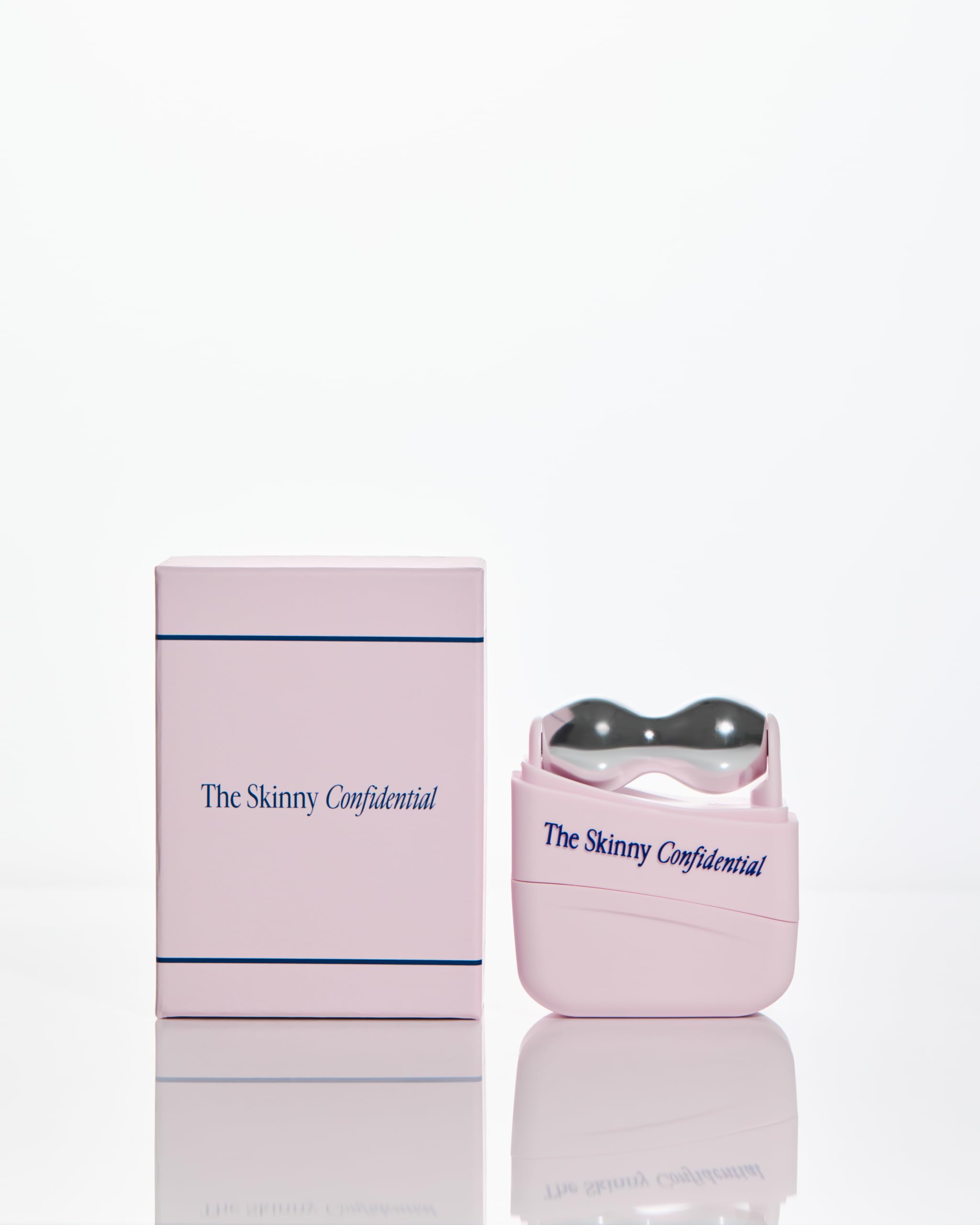 The Skinny Confidential roller beside hand for scale showing portable, travel-ready benefit