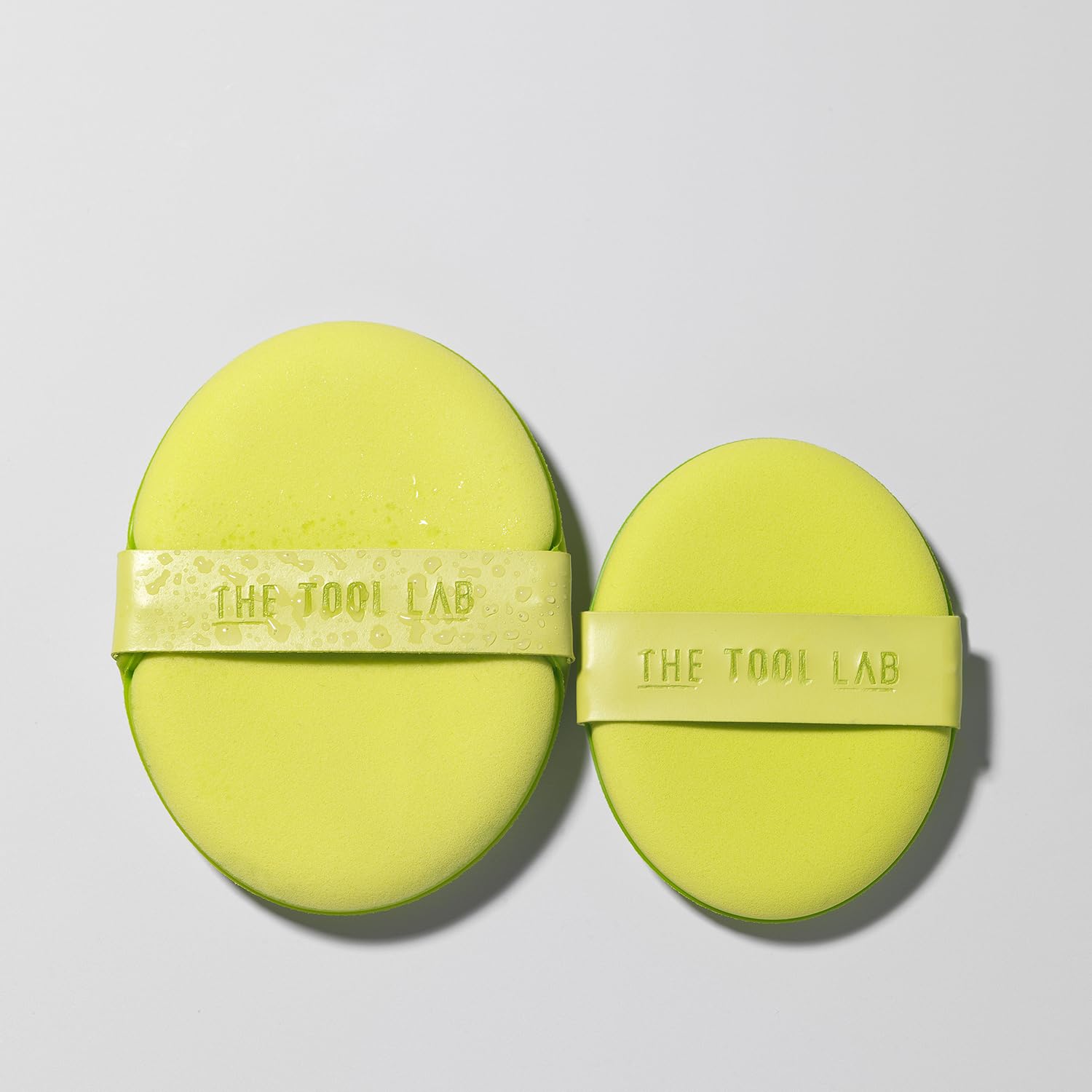 THE TOOL LAB sponge damp in hand demonstrating moisture retention for dewy finish