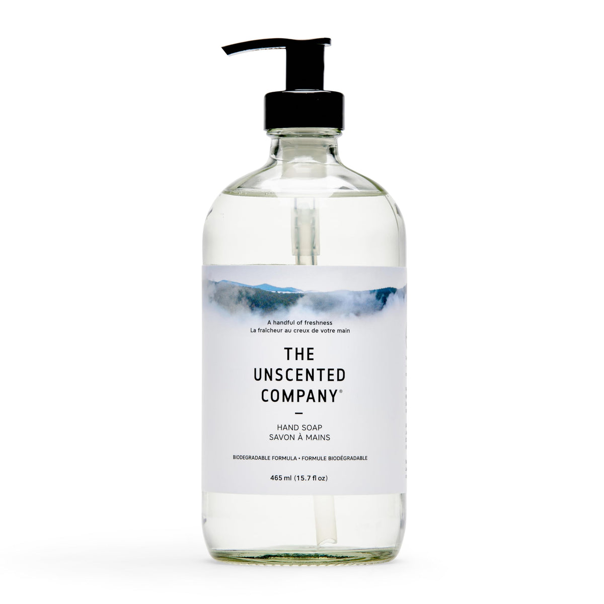The Unscented Company glass bottle front view showing minimalist label and refillable design benefit