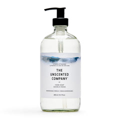 The Unscented Company glass bottle front view showing minimalist label and refillable design benefit