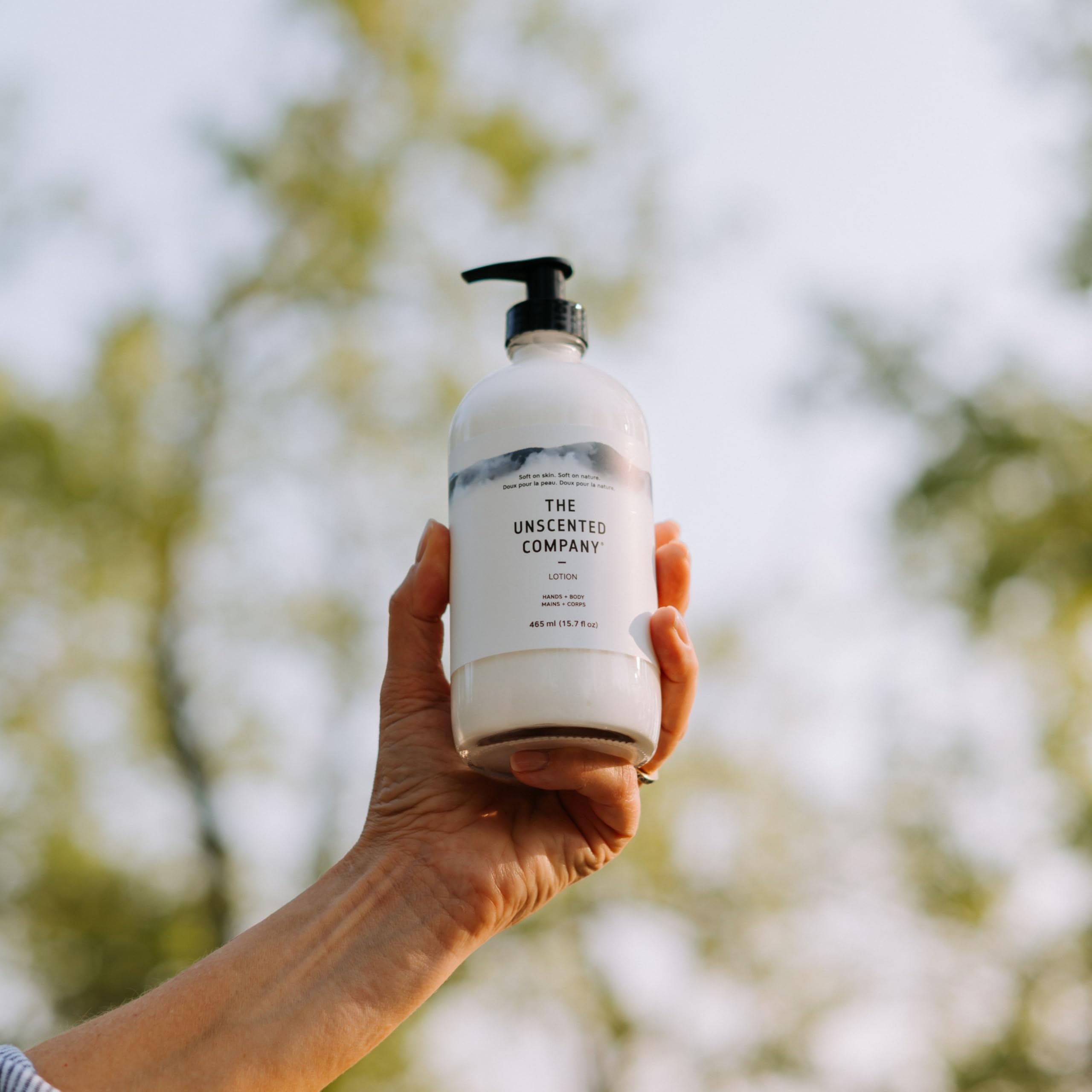 The Unscented Company lotion on bathroom shelf conveying simple daily use