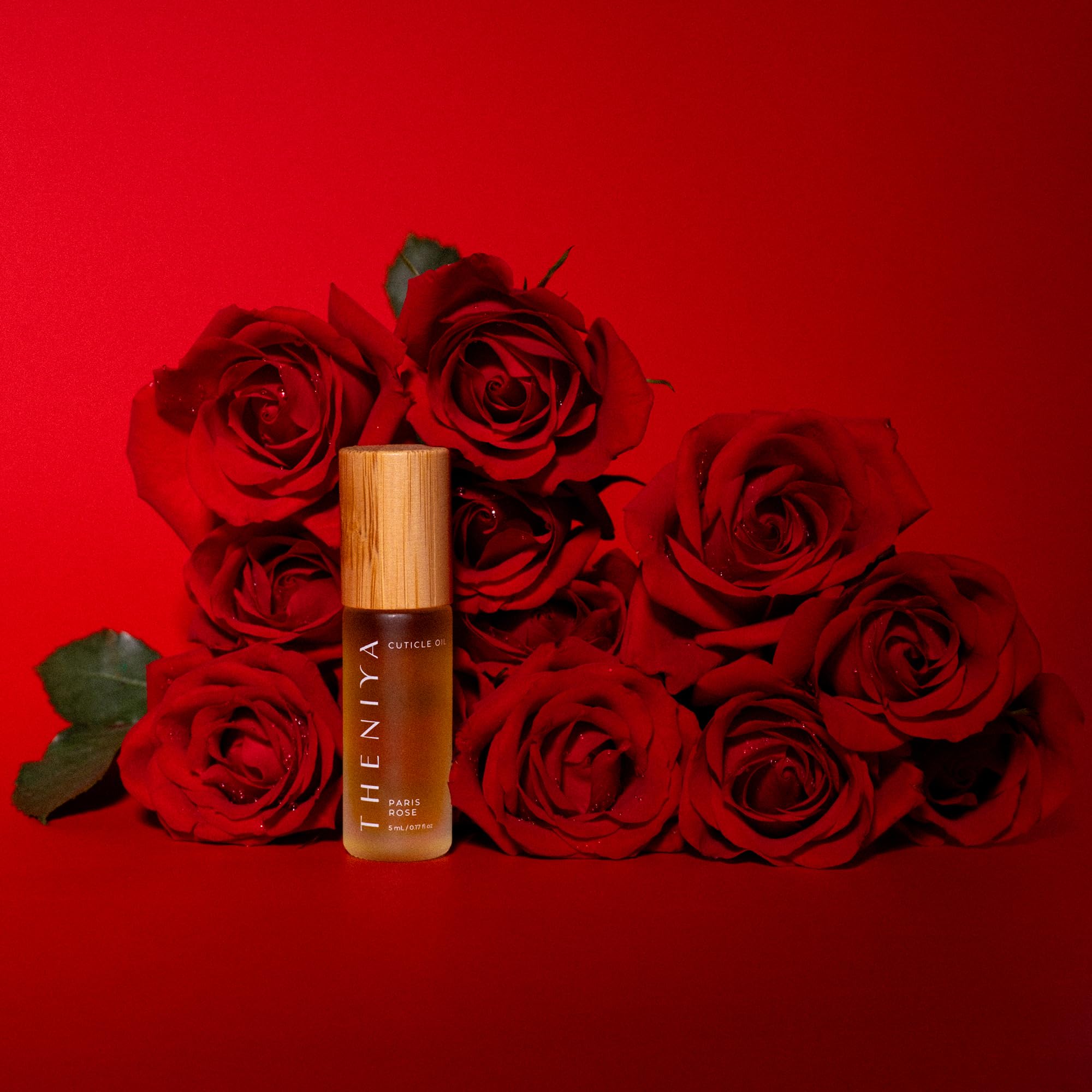 Theniya glass bottle with bamboo cap highlighting eco-friendly packaging benefit