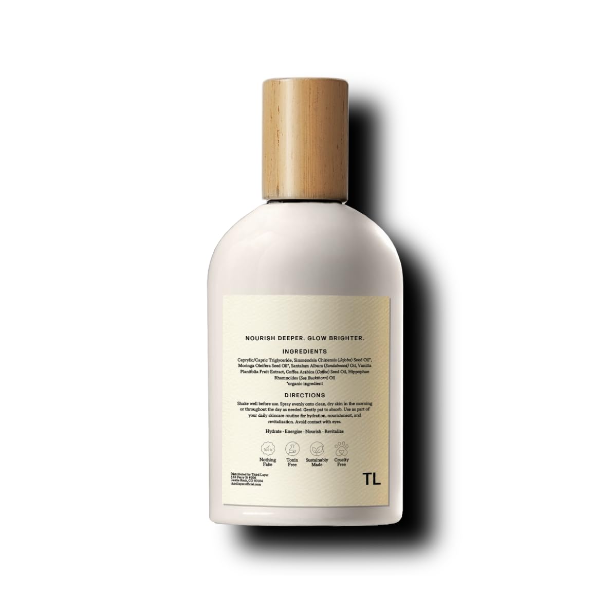 Third Layer lifestyle bathroom vanity display conveying premium glass bottle and morning ritual