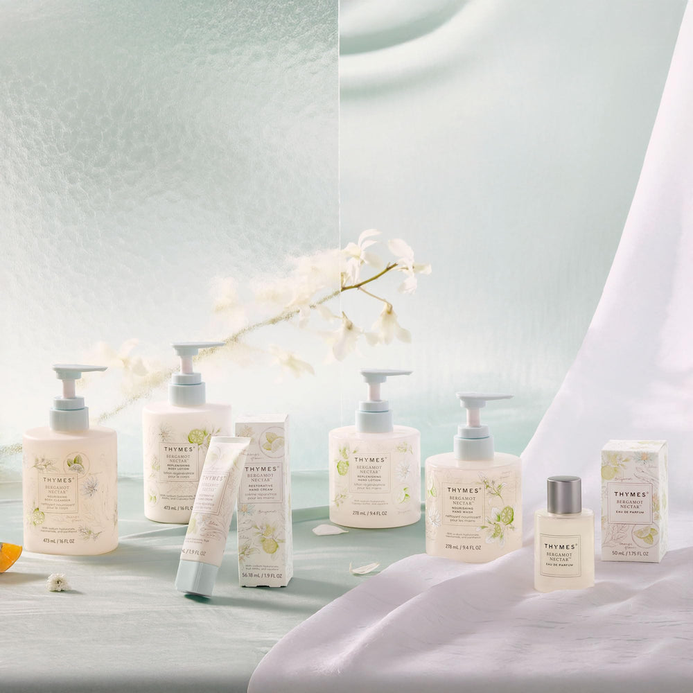 Thymes bottle next to everyday items for scale showing compact 9.4 fl oz convenience