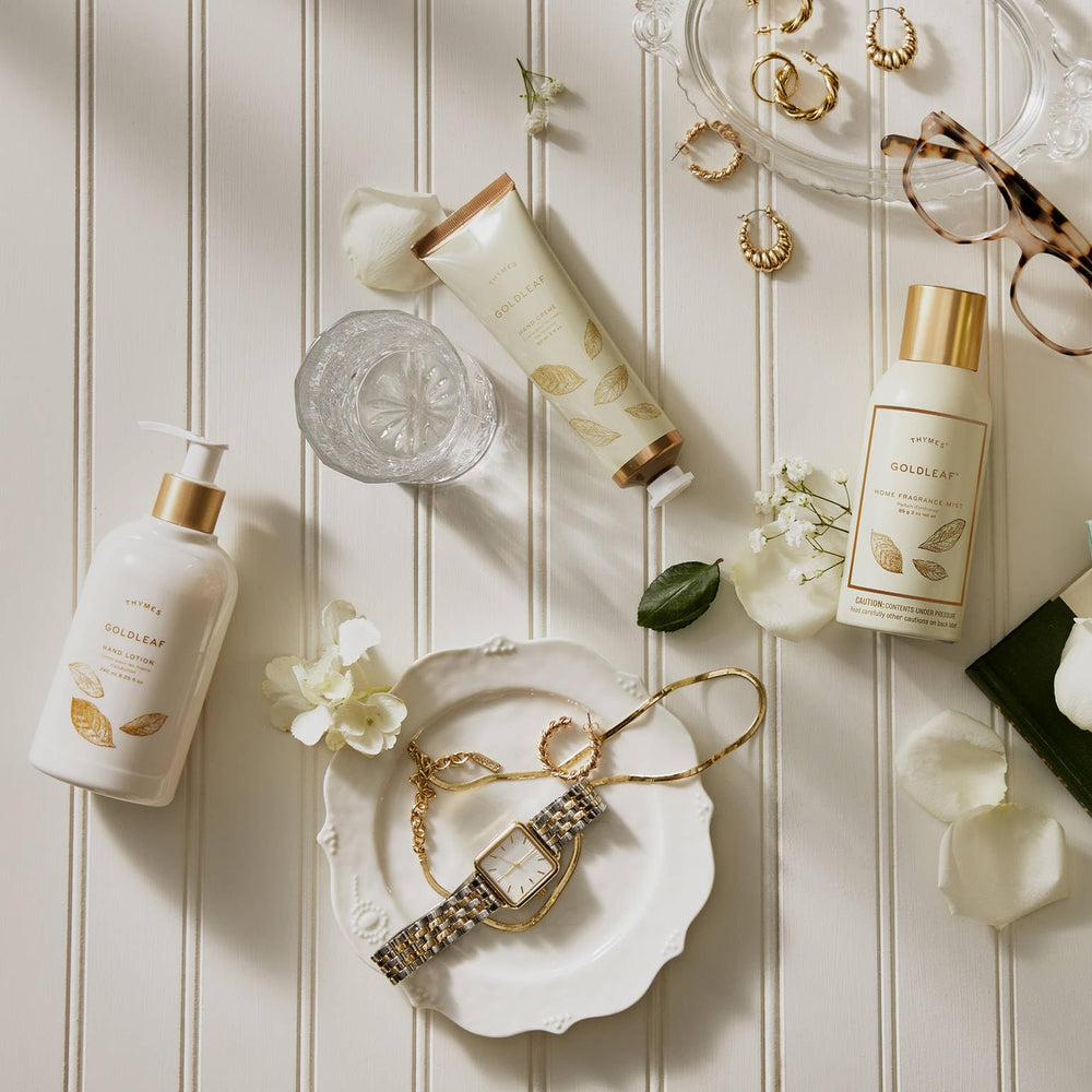 Thymes Goldleaf placed on bathroom sink adding decorative style and fragrance benefit