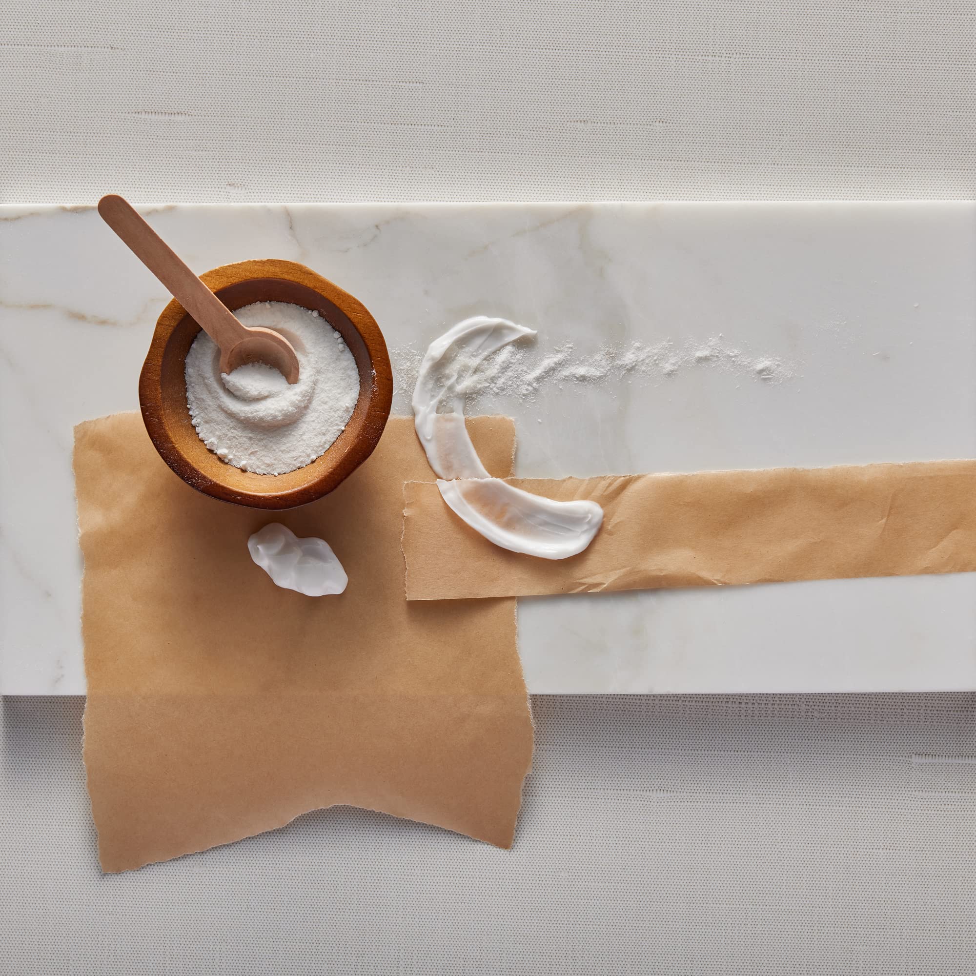 Thymes Kimono Rose beside a measuring object showing 8.25 fl oz scale