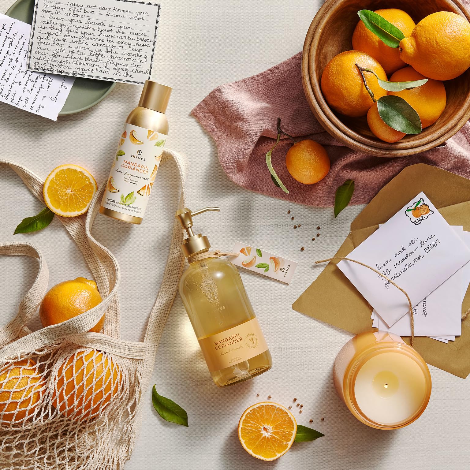 Thymes 24.5 fl oz bottle next to a hand for scale demonstrating generous refill volume