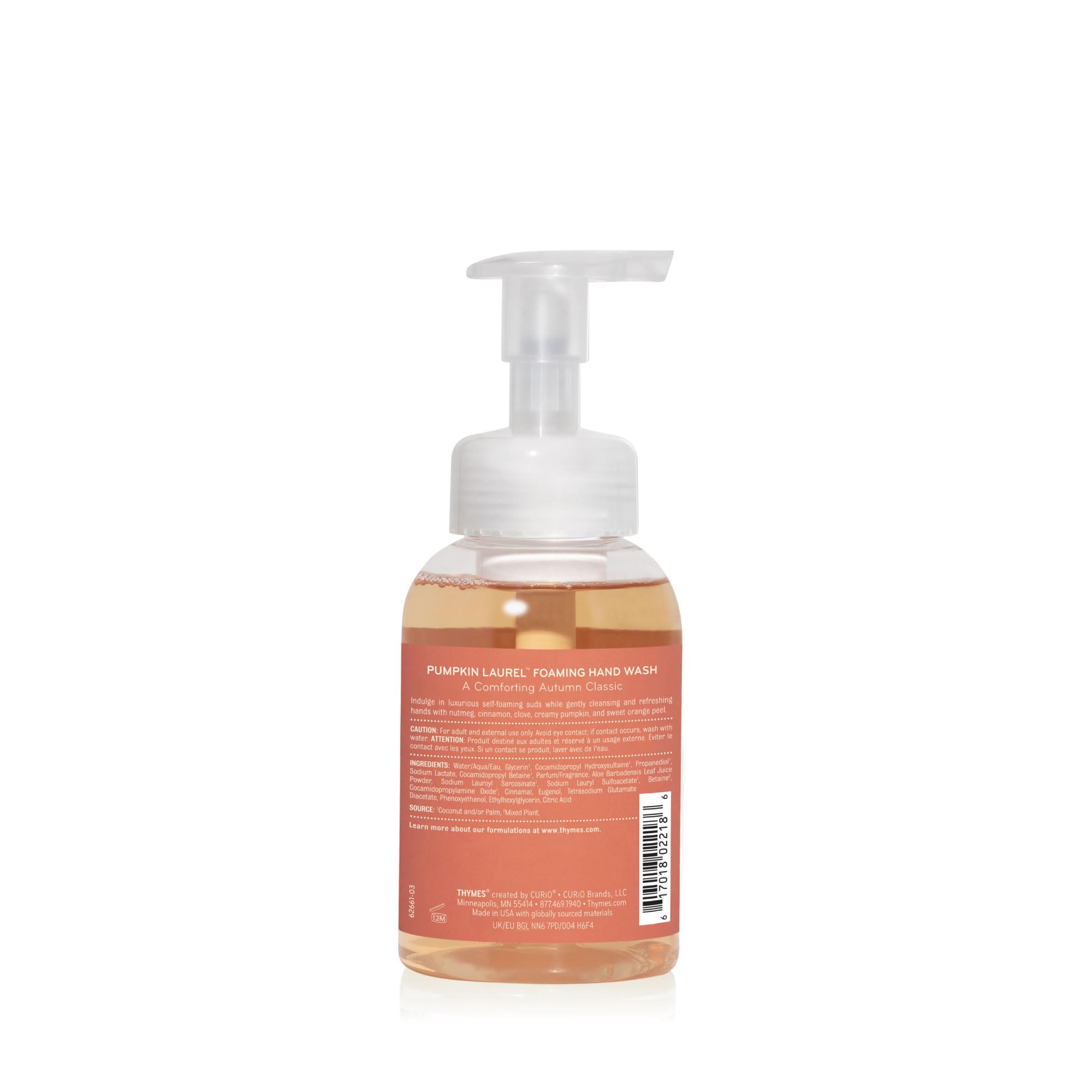 Thymes bottle next to a hand to show 10.3 oz size and practical countertop scale