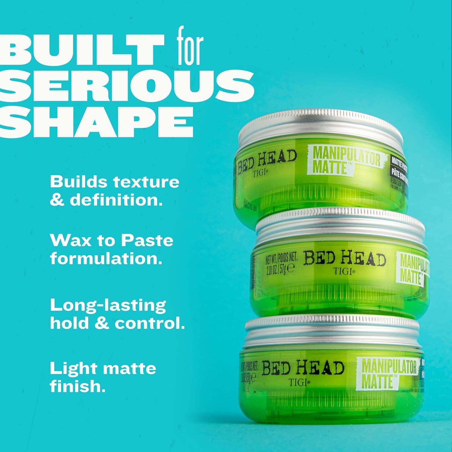 Applying TIGI Bed Head paste between palms for even distribution and control