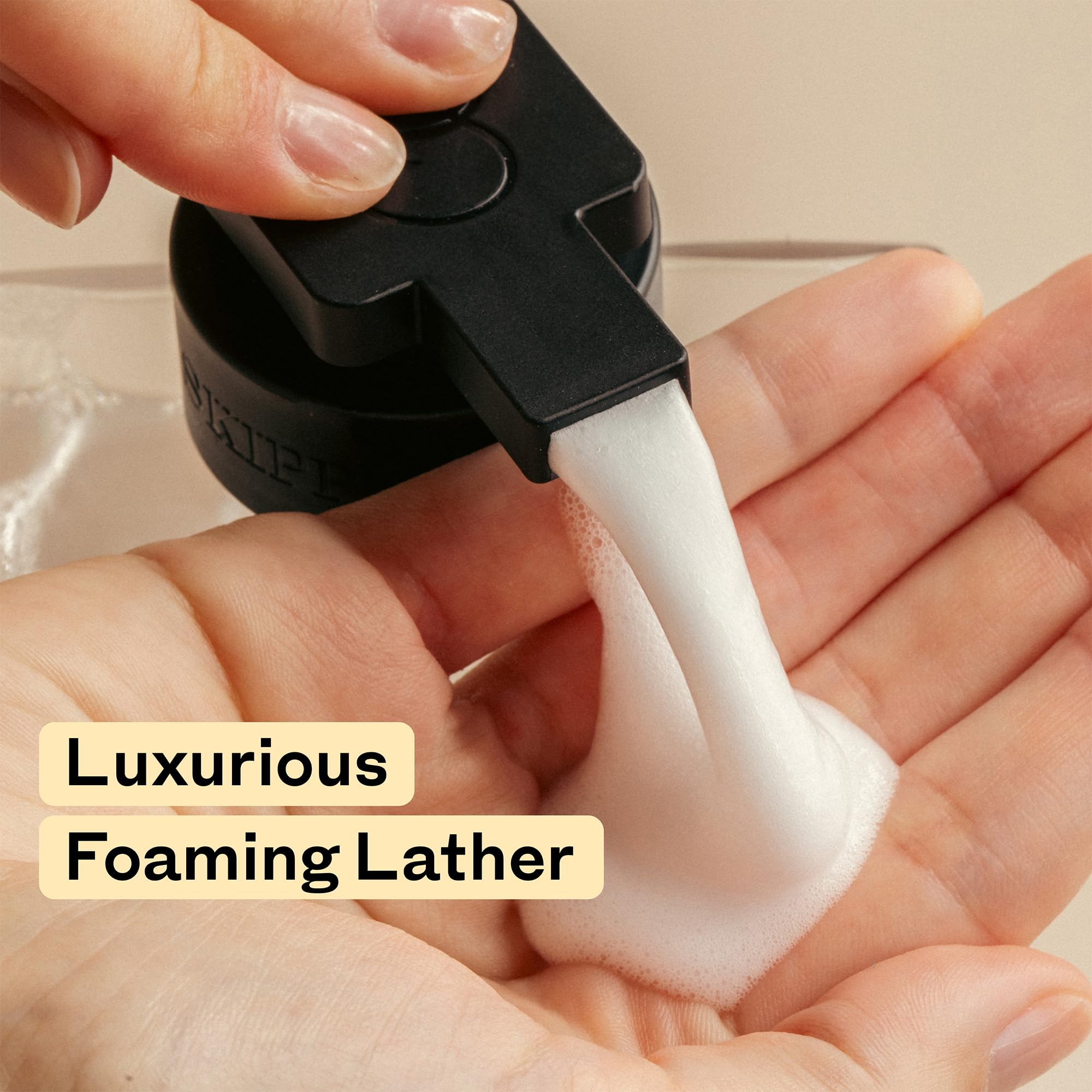 Tirtyl Skipper dispenser next to hand for scale showing compact refillable size