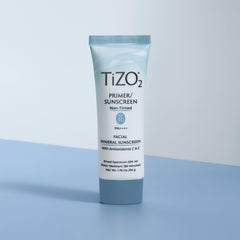 TIZO TiZO2 tube held in hand to show 1.75 oz size for travel and daily use