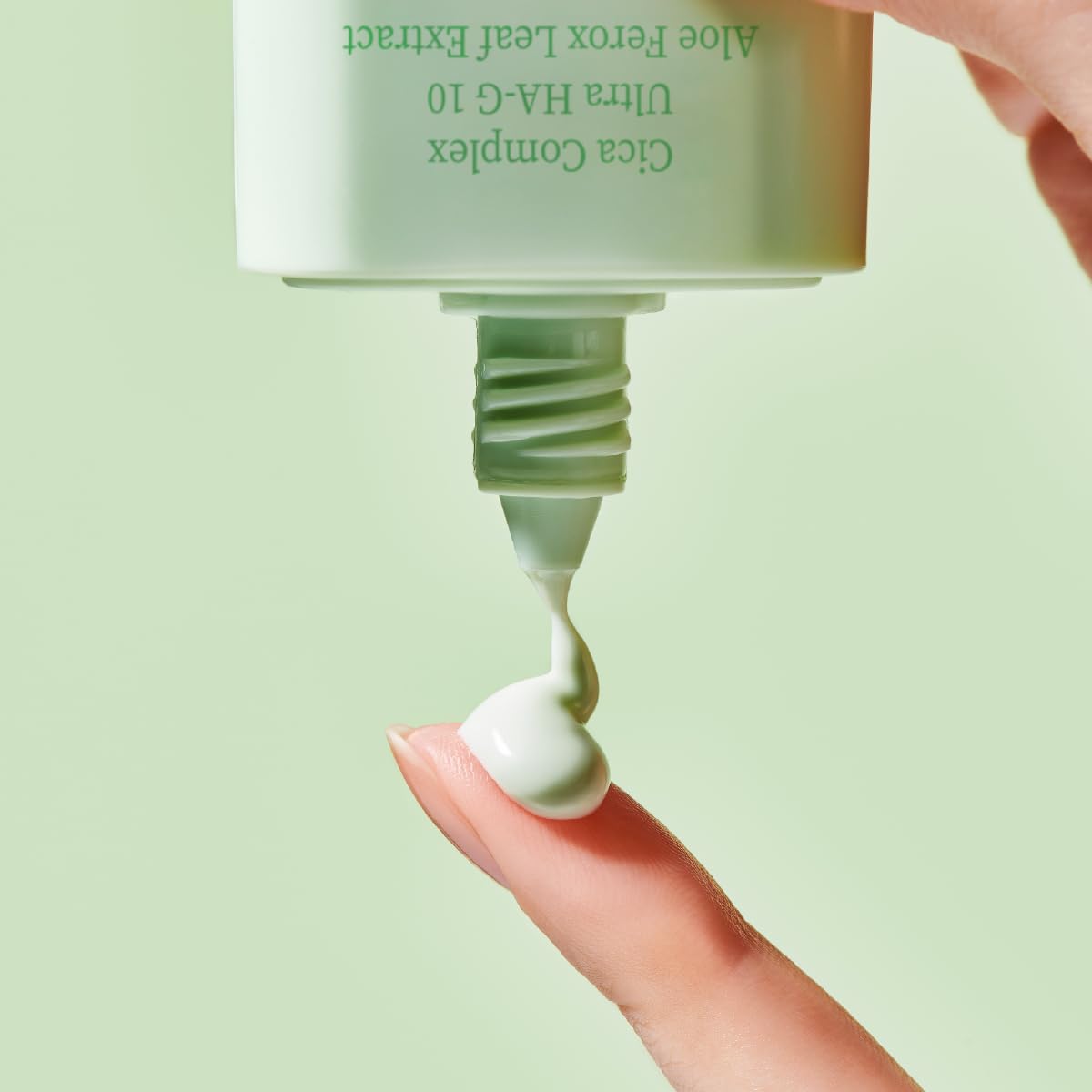 TOCOBO bottle held in hand illustrating product size and portability