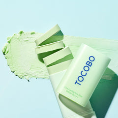 TOCOBO applying sun stick to cheek for quick, targeted protection