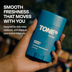 TONE applying stick to underarm demonstrating simple everyday use