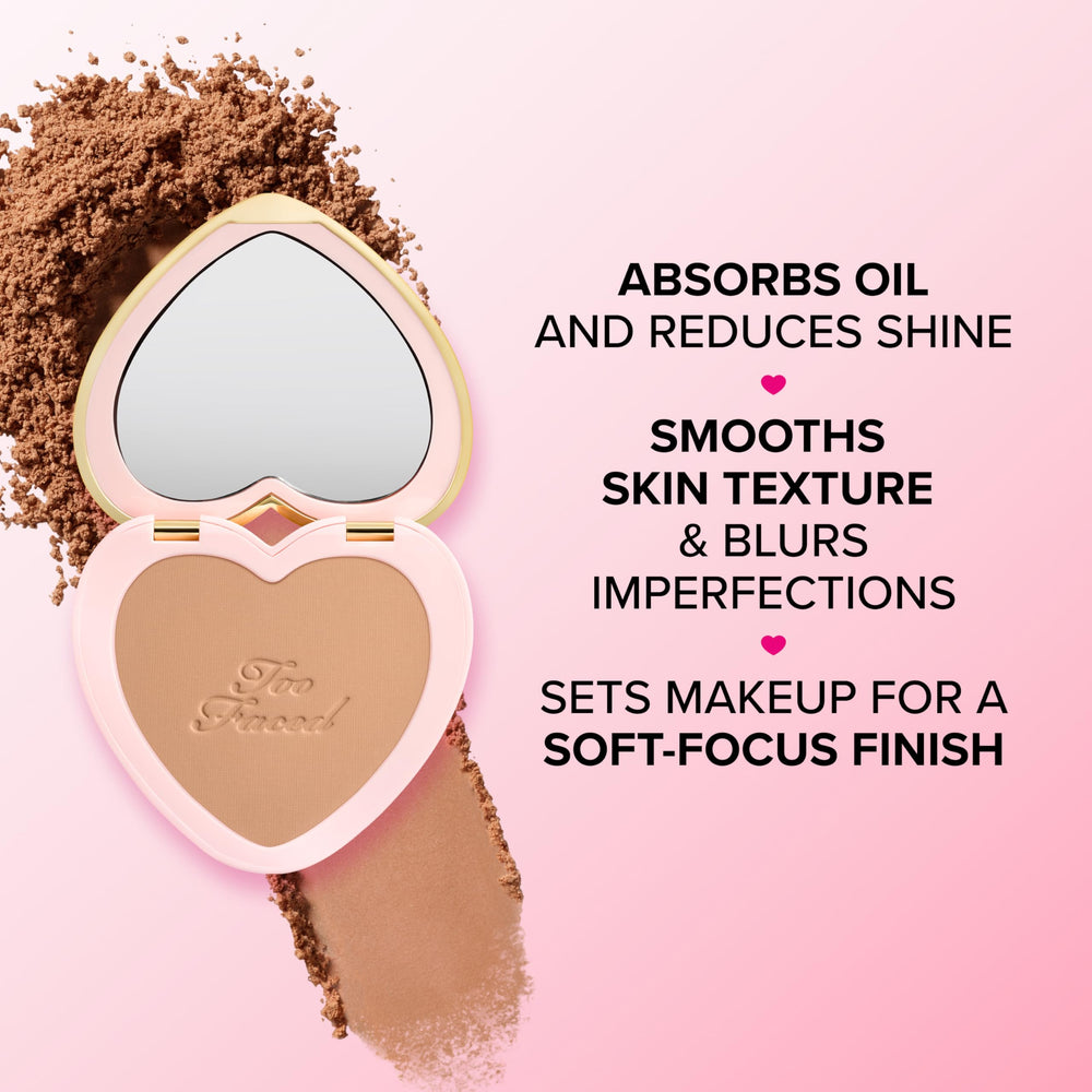 Too Faced powder being applied with brush delivering soft-focus, shine-free skin