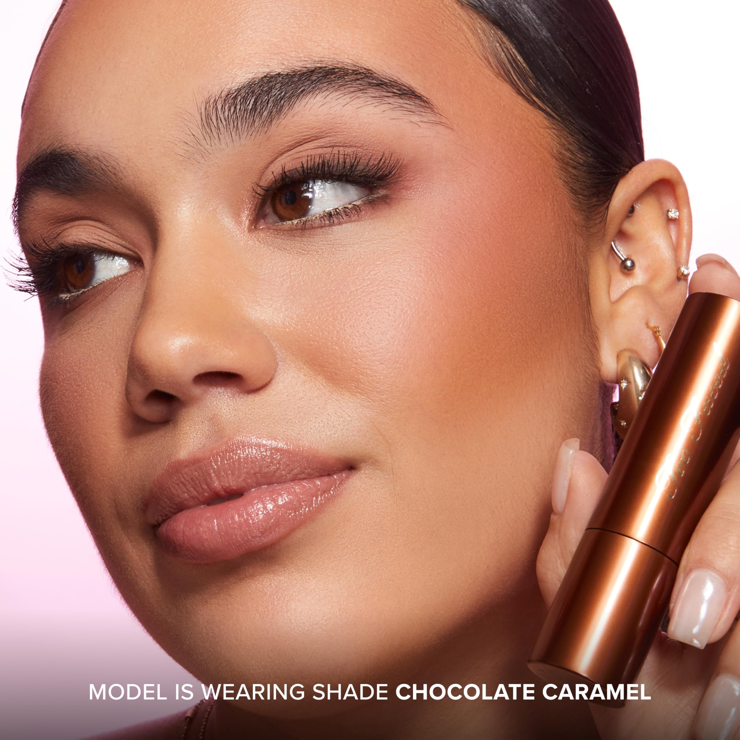 Too Faced lifestyle shot of product by vanity for quick on-the-go bronze