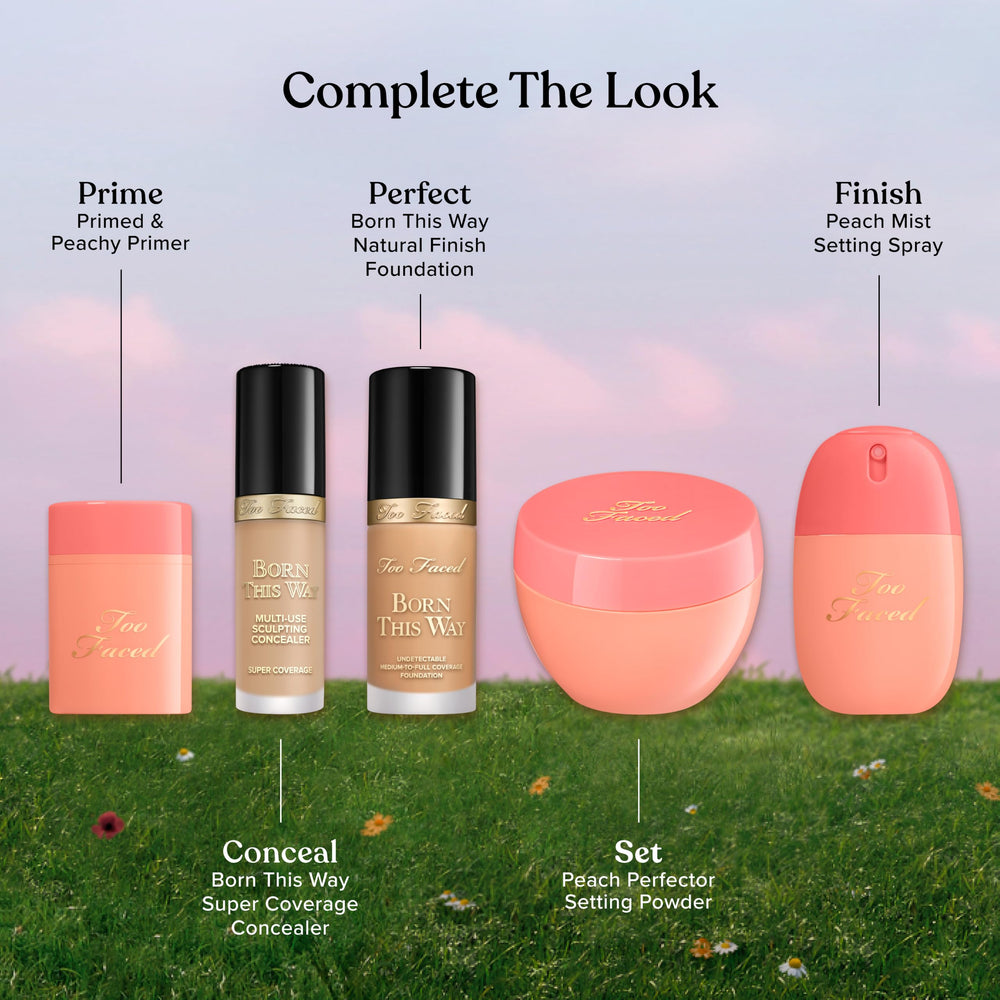 Too Faced Peach Mist placed beside a makeup kit for quick on-the-go touch-up benefit