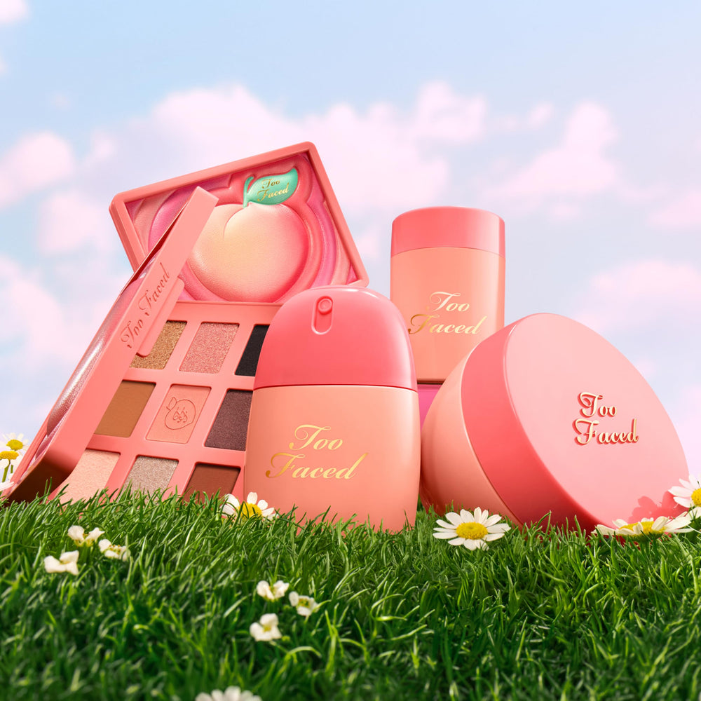 Amber bottle of Too Faced Peach Mist with ingredient list visible to show hydration benefit