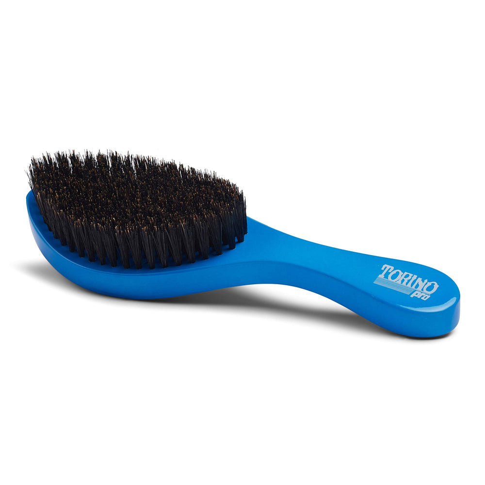 TORINO PRO WAVE BRUSHES BY BRUSH KING held in hand to show size and control for efficient brushing