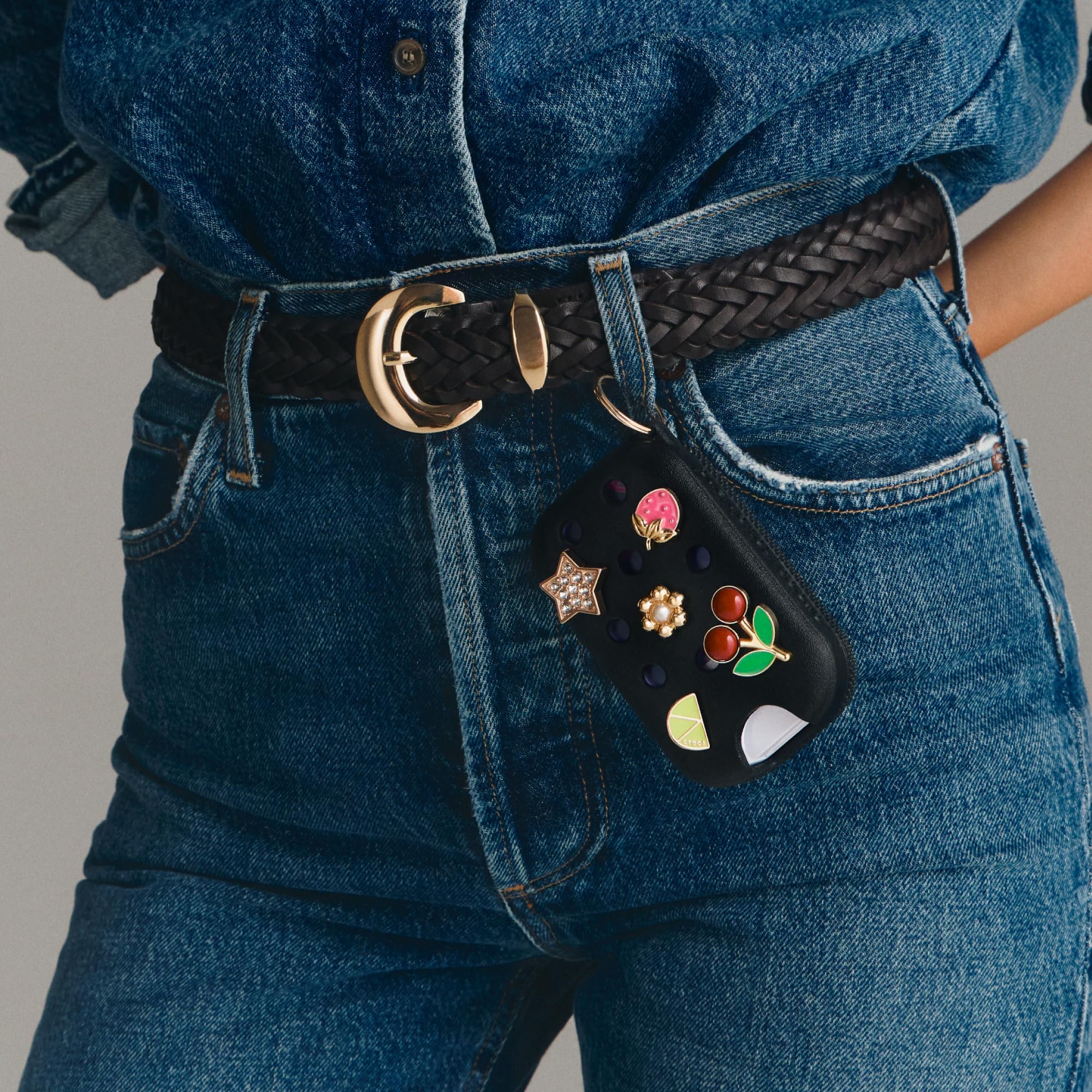 Touchland case mounted on Crocs shoe demonstrating wearable convenience