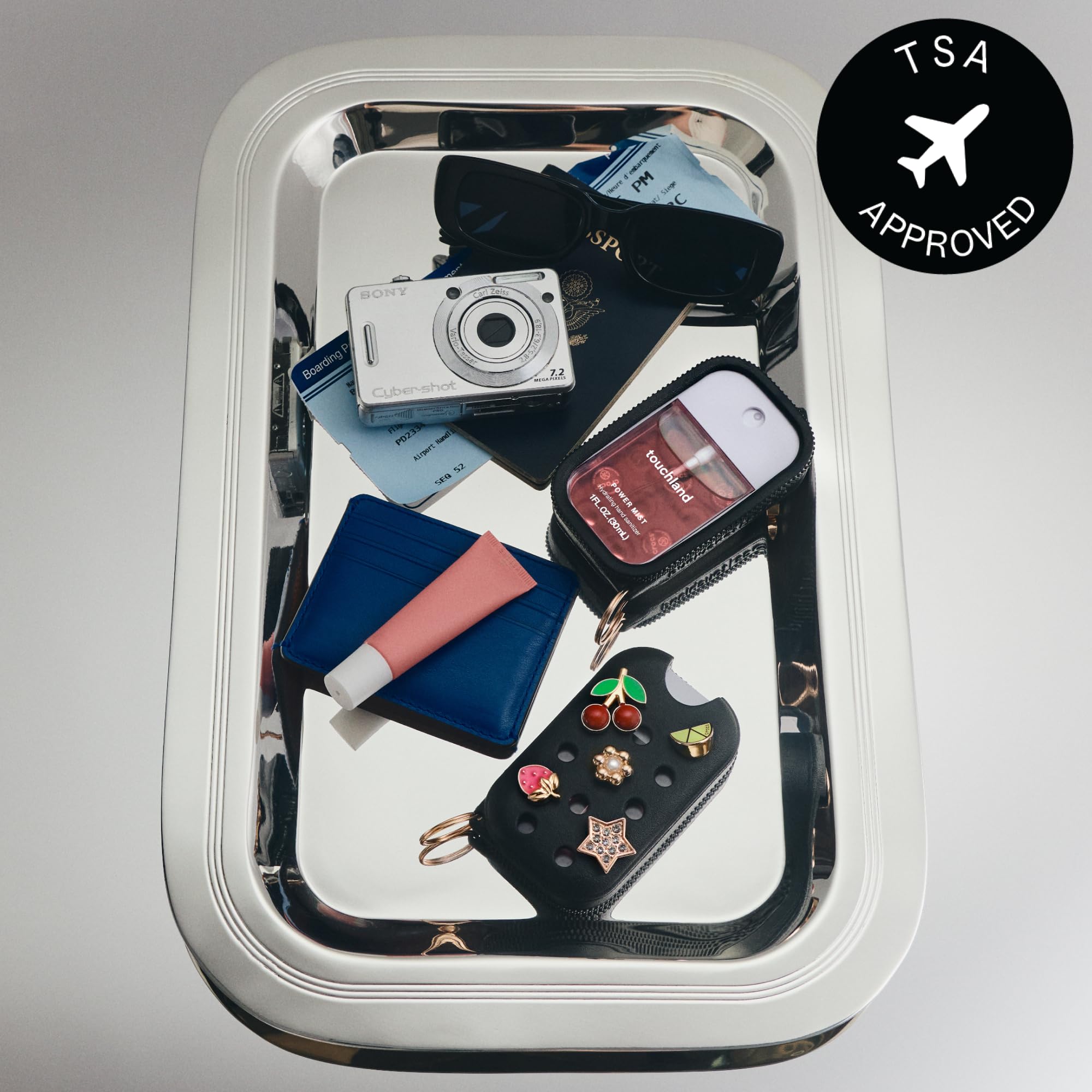 Touchland case open with 30mL bottle visible for easy refill and use