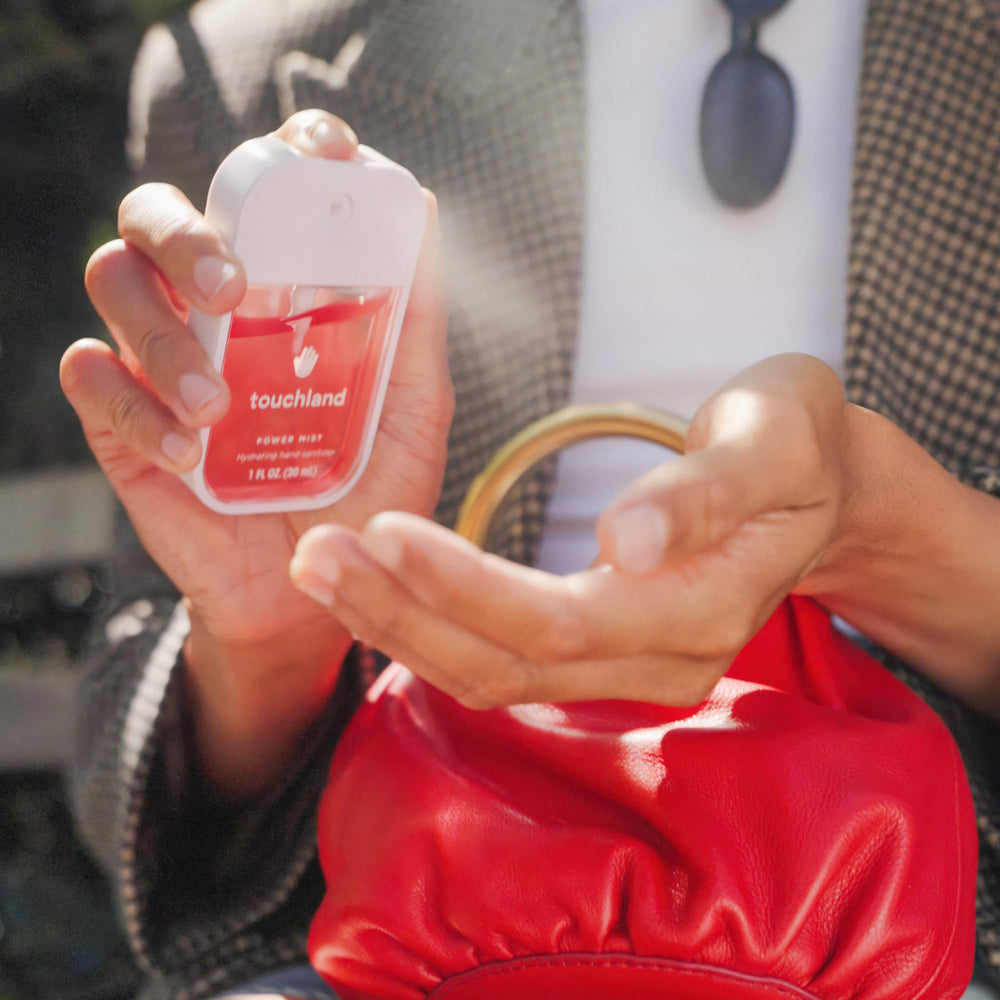 Touchland sanitizer bottle detail with ergonomic design for quick use