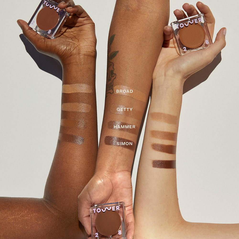 Tower 28 next to foundation bottle, blends seamlessly with base makeup benefit