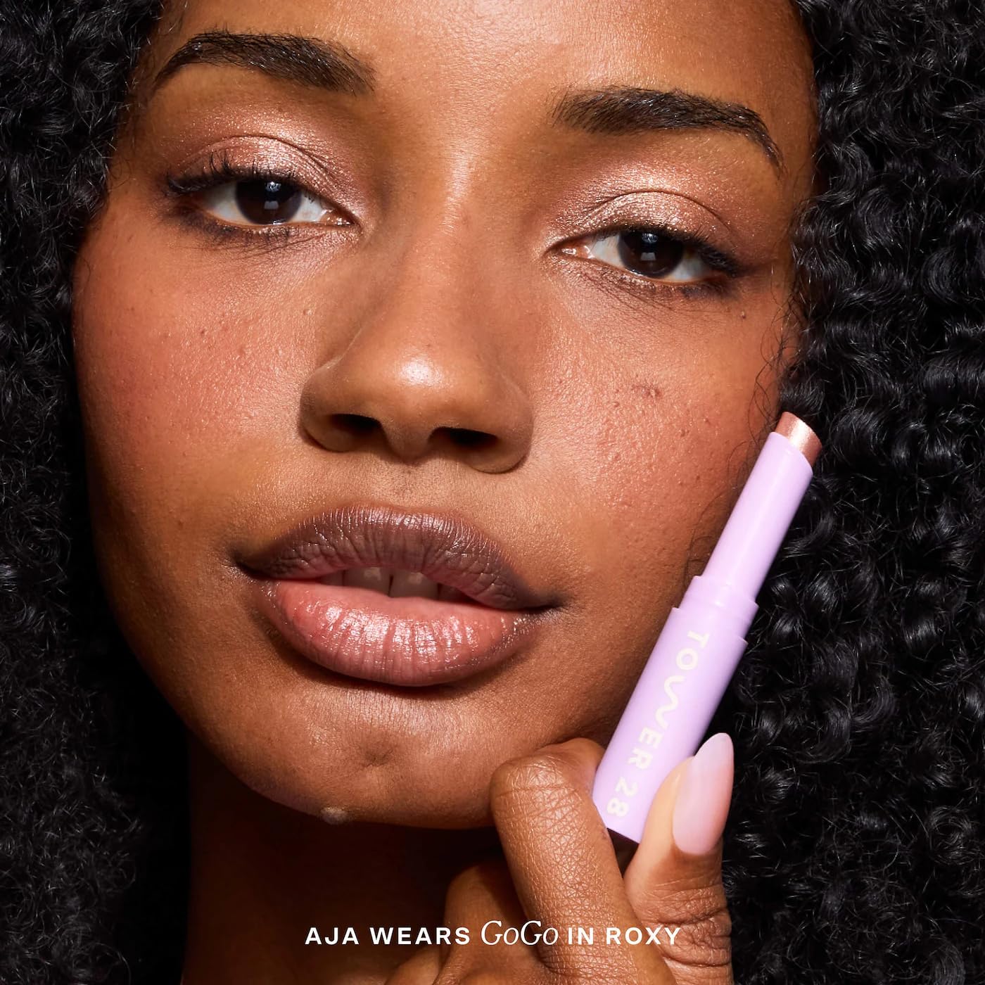 Tower 28 used as highlighter on nose bridge for targeted luminous effect