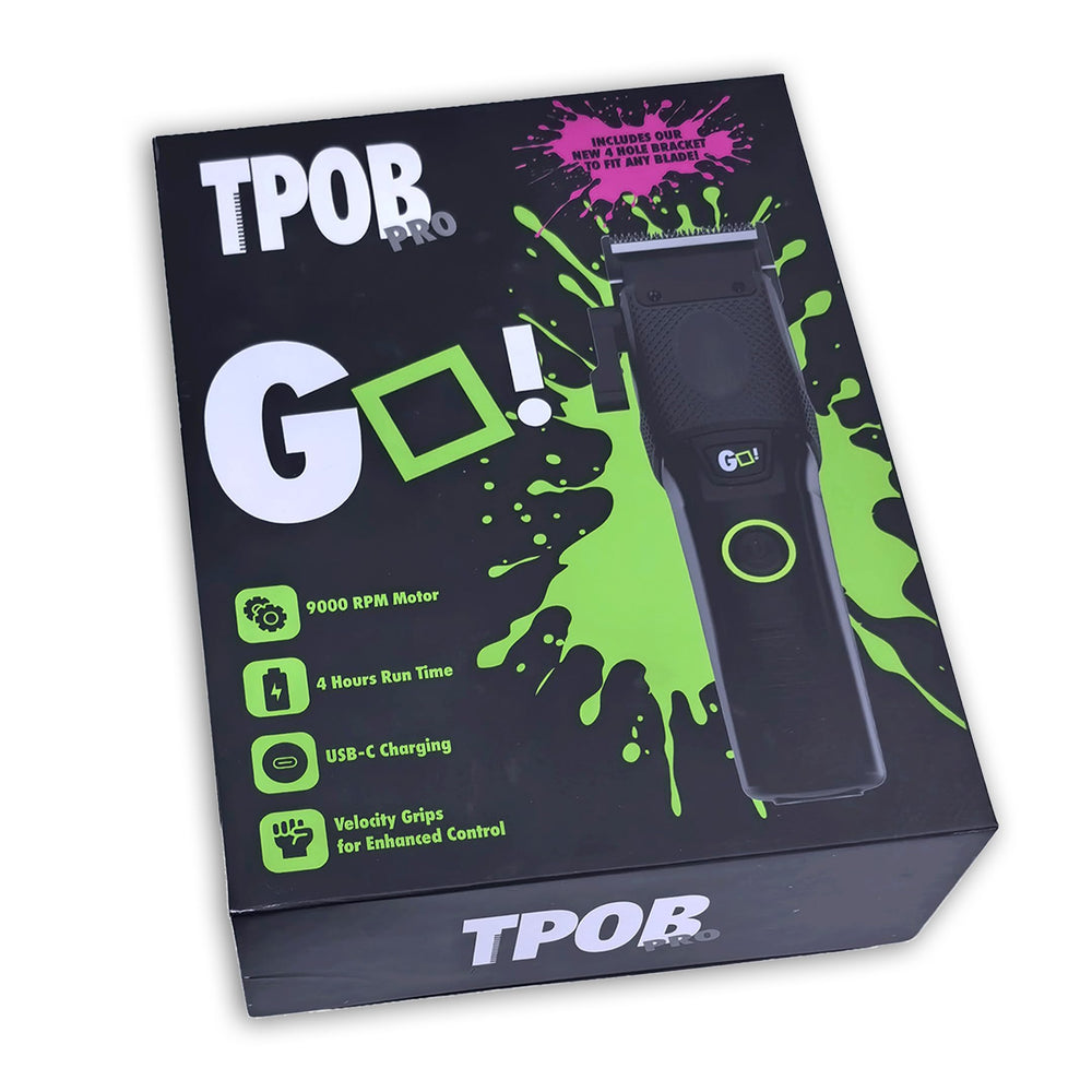 TPOB clippers on barber workstation with scissors, illustrating salon-ready performance